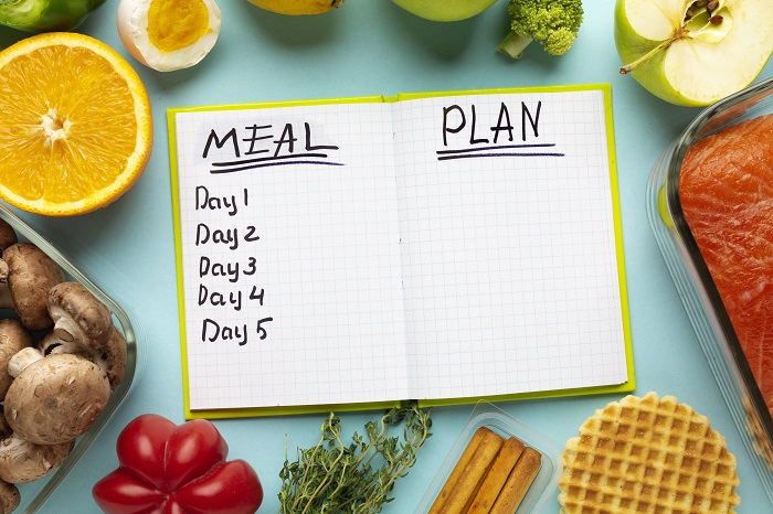 top-view-arrangement-with-meal-planning-notebook