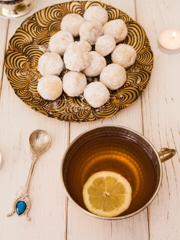 flat-lay-pastries-lemon-tea_23-2148214417